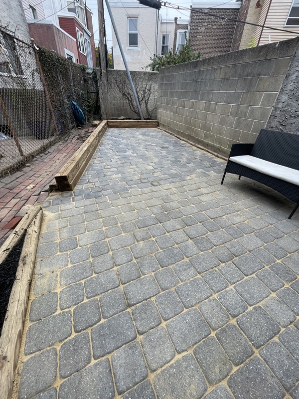 Extended to one level Fishtown backyard using paver bricks from Home Depot
